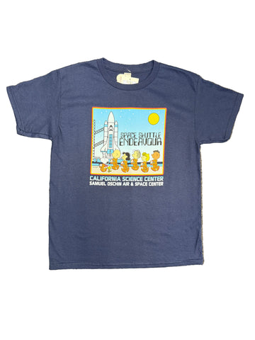 A blue short-sleeve graphic t-shirt laid flat. The shirt features a colorful retro space shuttle Endeavour graphic with the Peanuts crew characters and text for the California Science Center.