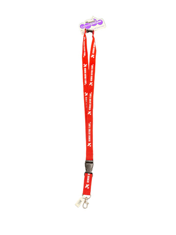 Red lanyard with "Remove Before Flight" logo on a white surface.