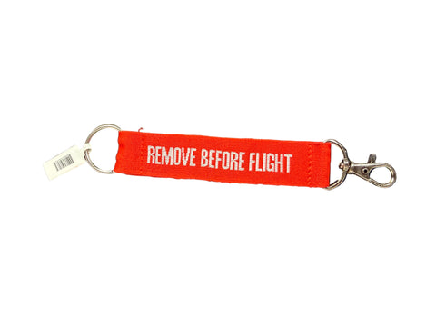 Red keychain with 'REMOVE BEFORE FLIGHT' text.